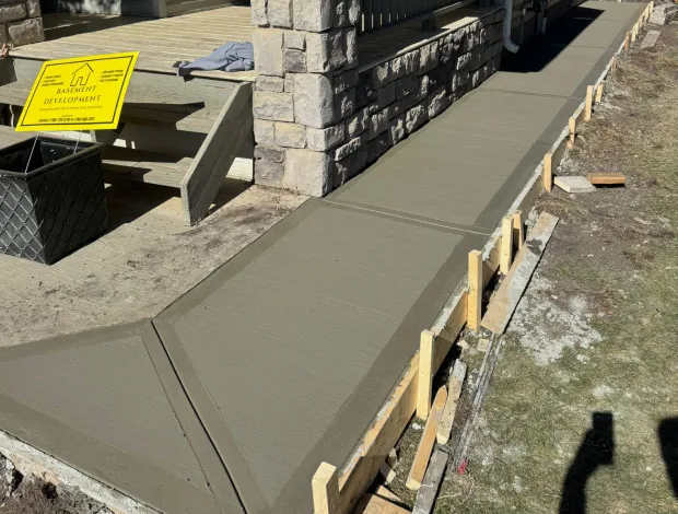 Broom-textured concrete sidewalk with neat edging and control joints