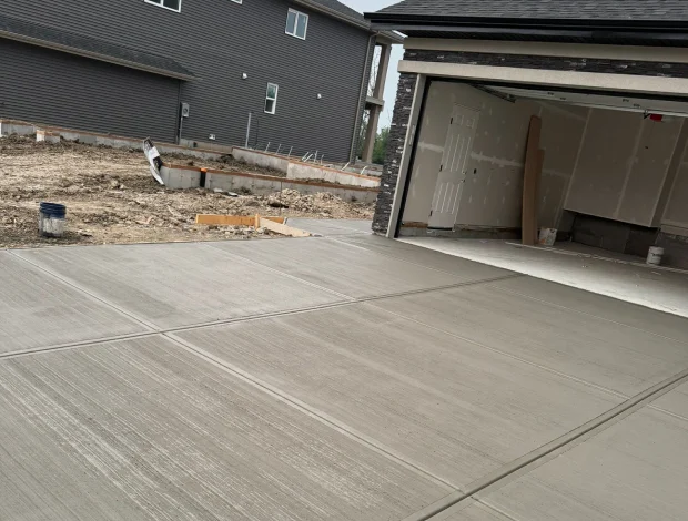 Broom finish concrete driveway with clean lines and a practical textured surface
