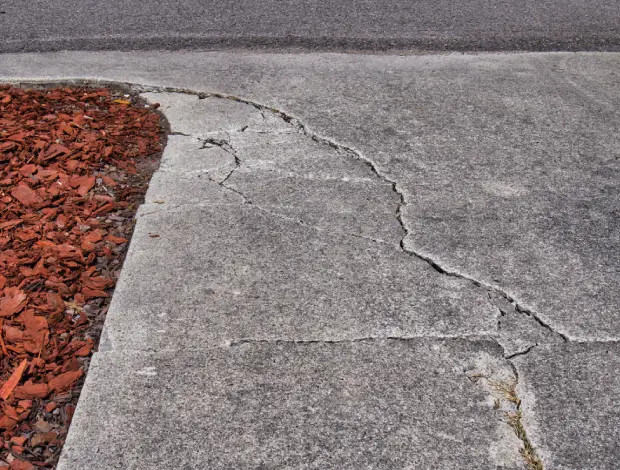 Concrete slab repair work on a damaged outdoor surface in Edmonton