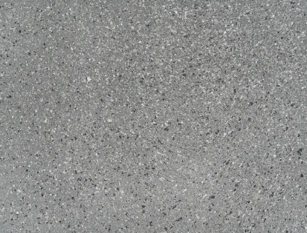 Decorative patio with exposed aggregate finish and visible stone detail