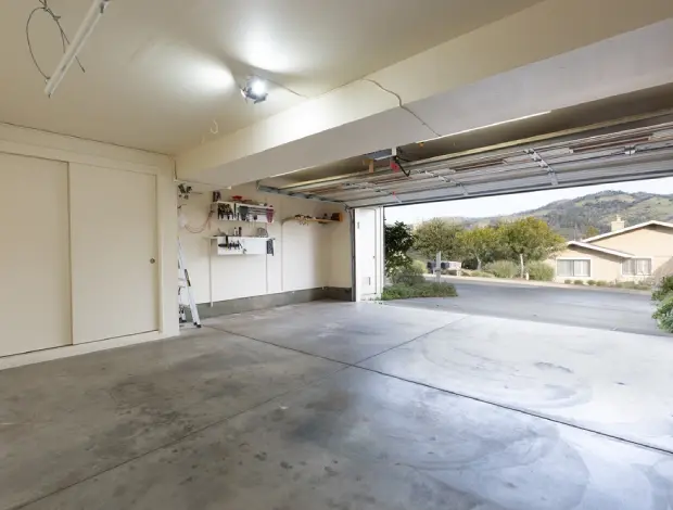 Garage concrete slab with clean finishing and proper slope in Edmonton