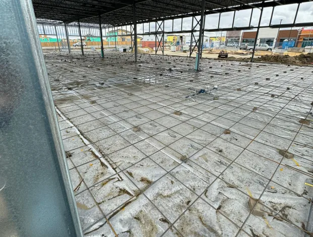 Concrete pad installation with compacted base and formed edges for residential use