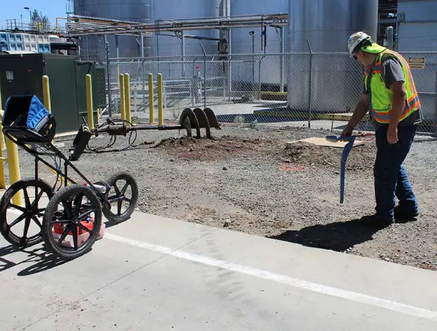 Utility locate markings before concrete demolition and site preparation in Edmonton