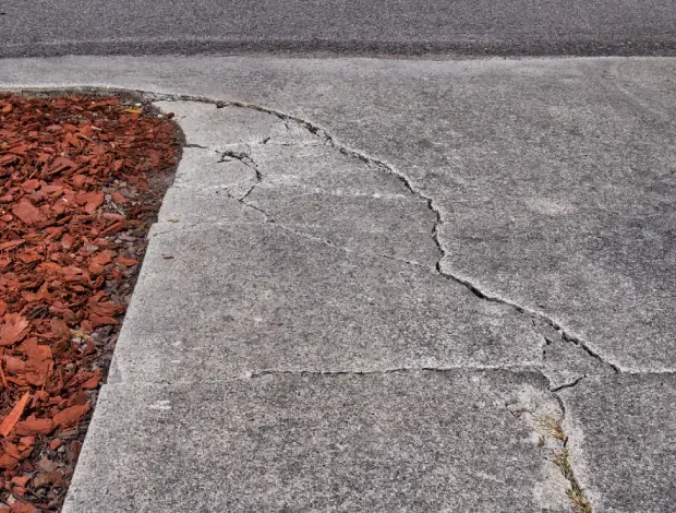 Concrete slab repair work on a damaged outdoor surface in Edmonton