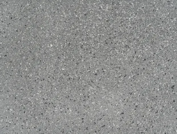 Decorative patio with exposed aggregate finish and visible stone detail