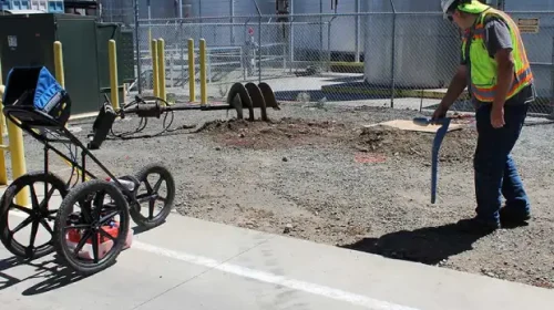Utility locate markings before concrete demolition and site preparation in Edmonton